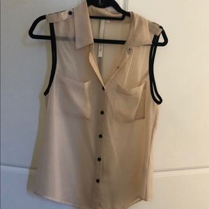 Sheer nude sleeveless blouse with black piping